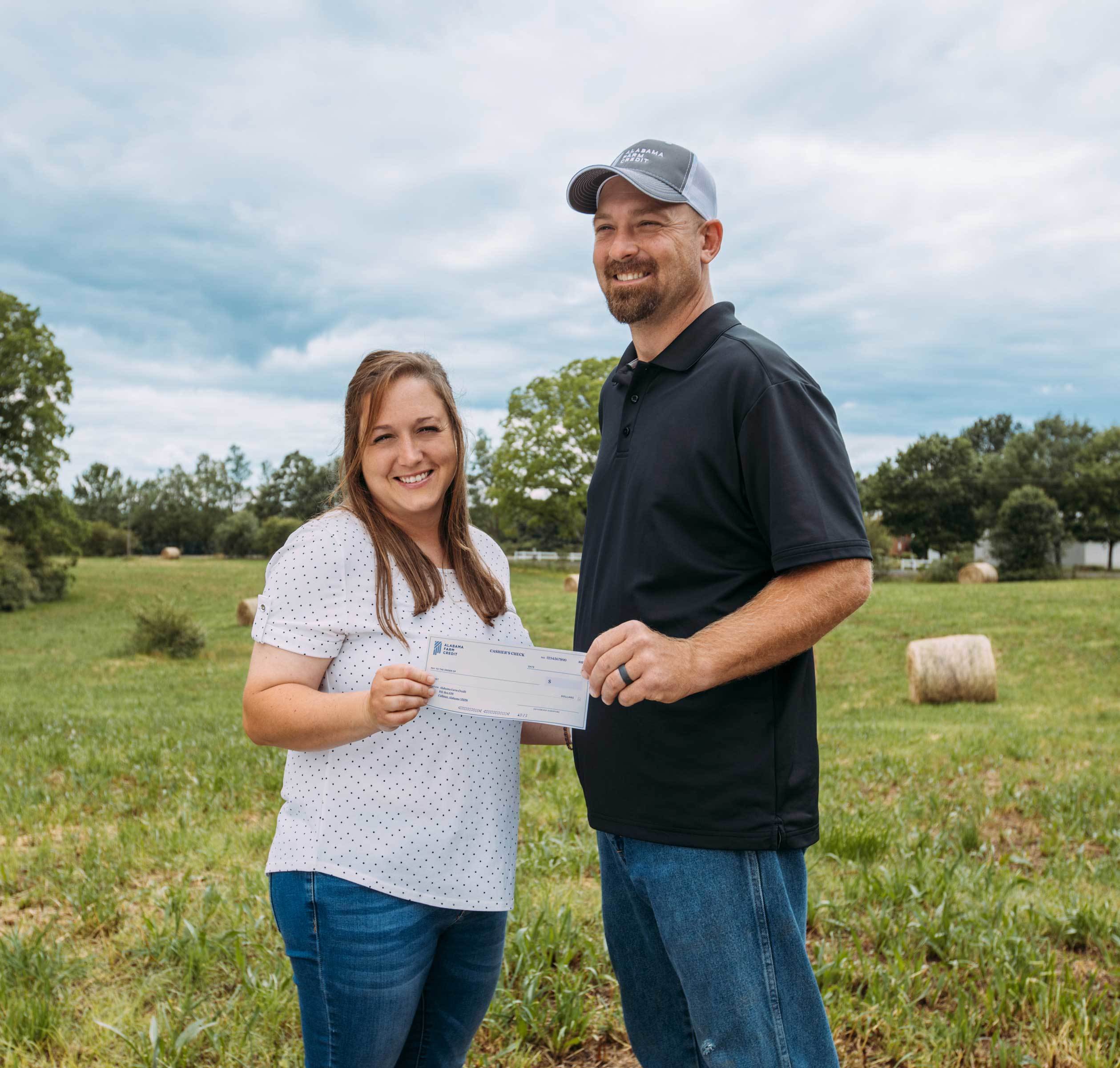 benefits-of-a-coop-borrowers-are-stockholders couple with check