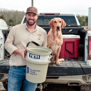 seth moore holds 2020 alabama fcorn yield contest prize